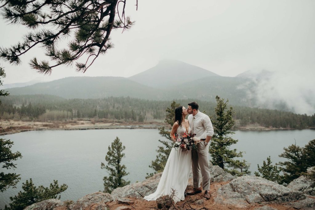 Rocky Mountain National Park Wedding, Couple at Lily Lake, Elopement couple at Lily Lake, Rainy day at rocky mountain national park, rocky mountain national park wedding guide, how to elope at rocky mountain national park