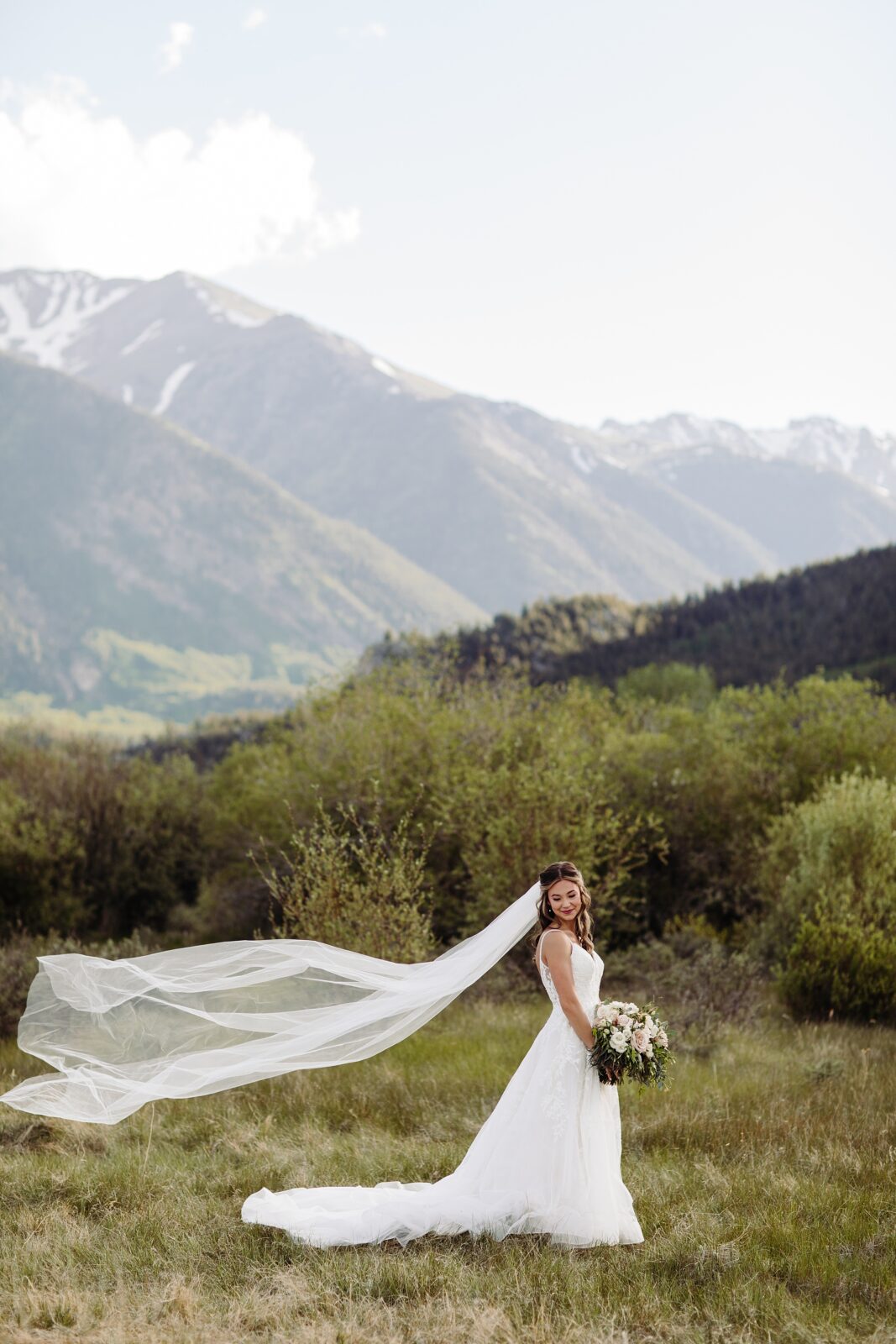 Colorado spring elopement, meadow elopement, whimsical elopement, colorado mountain elopement, colorado wildflower elopement, colorado intimate wedding, colorado wedding photographer, wedding photos in wildflowers, wedding in the meadows, Leah Goetzel Photography, elopement wedding dress inspiration, intimate wedding inspiration, Colorado lake elopement, Twin lakes elopement