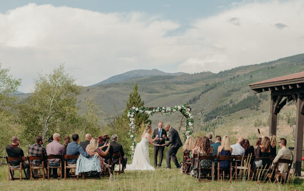 wedding ceremony apache ranch with mountains in the background