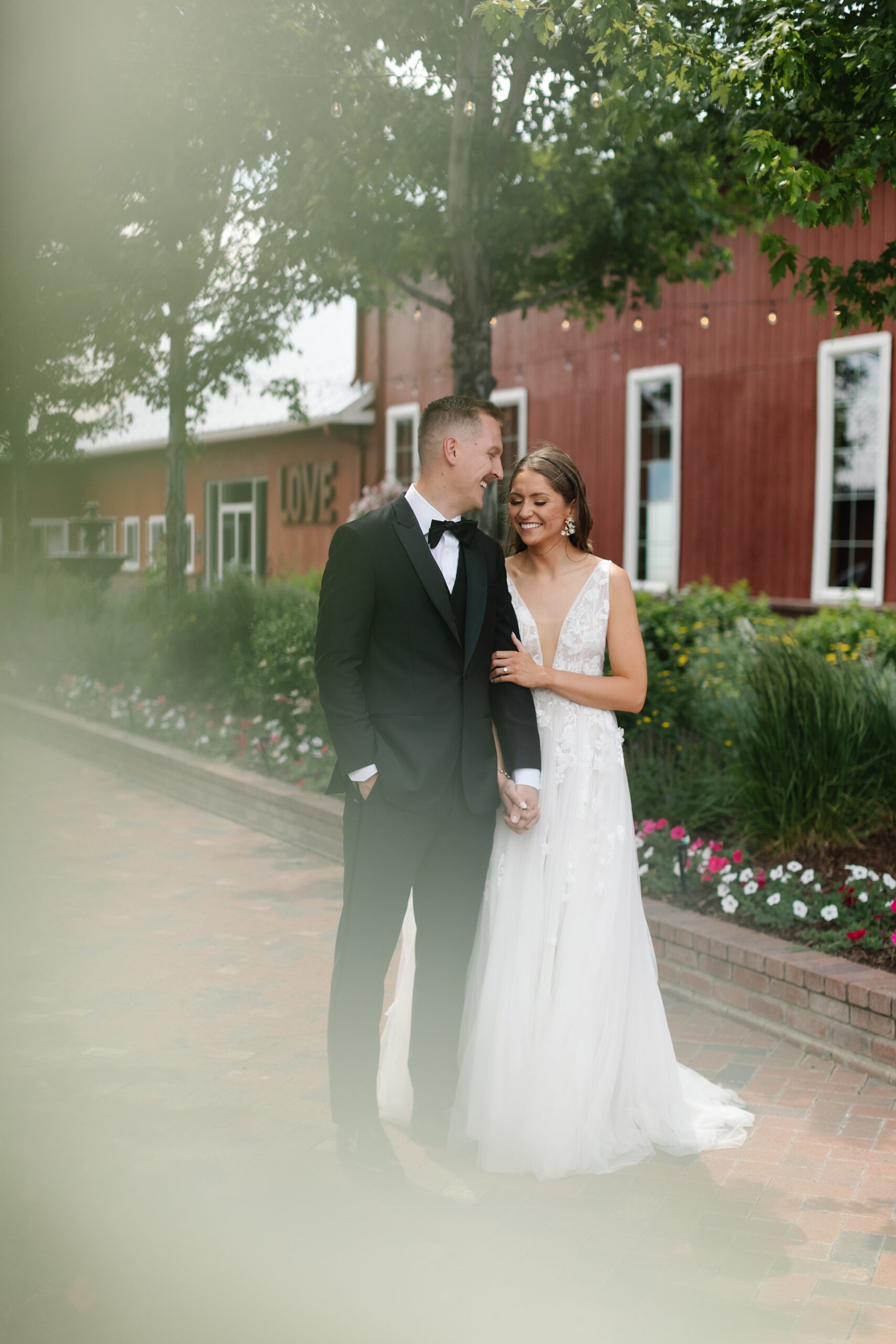 The Venue at Crooked Willow Farms Wedding, summer wedding crooked willow farms, candid wedding photography, barn wedding venues Colorado, modern barn weddings, tour of crooked willow farms, crooked willow farms wedding pricing, wedding cape inspiration, rust color bridesmaid dresses, orange and terracotta wedding colors, unique tablescapes wedding, starwars tablescape wedding idea, couples photos crooked willows, Leah Goetzel photography, Colorado wedding photographer, Denver wedding photographer