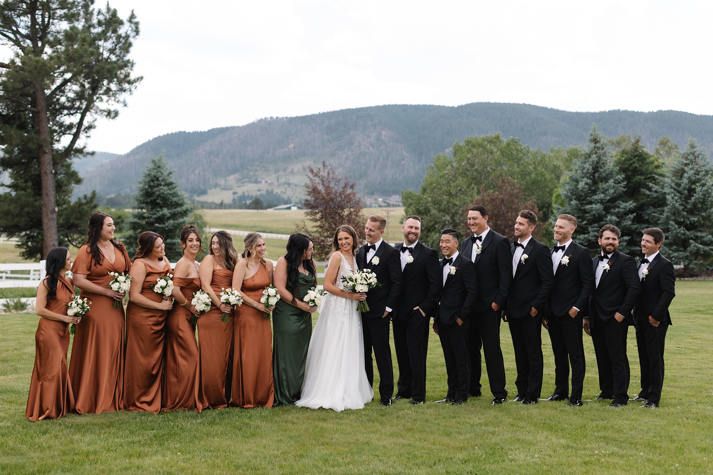 The Venue at Crooked Willow Farms Wedding, summer wedding crooked willow farms, candid wedding photography, barn wedding venues Colorado, modern barn weddings, tour of crooked willow farms, crooked willow farms wedding pricing, wedding cape inspiration, rust color bridesmaid dresses, orange and terracotta wedding colors, unique tablescapes wedding, starwars tablescape wedding idea, couples photos crooked willows, Leah Goetzel photography, Colorado wedding photographer, Denver wedding photographer