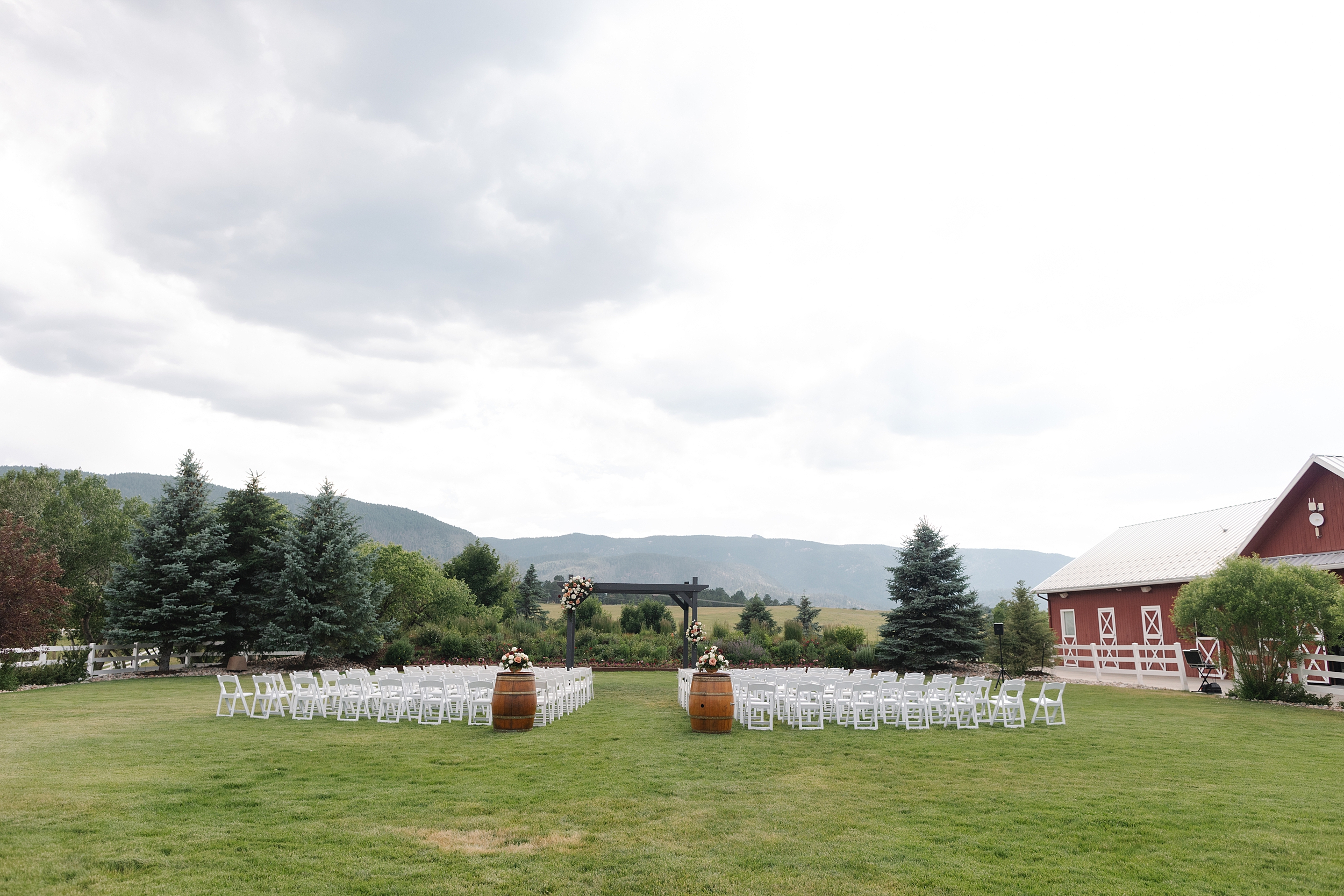 The Venue at Crooked Willow Farms Wedding, summer wedding crooked willow farms, candid wedding photography, barn wedding venues Colorado, modern barn weddings, tour of crooked willow farms, crooked willow farms wedding pricing, wedding cape inspiration, rust color bridesmaid dresses, orange and terracotta wedding colors, unique tablescapes wedding, starwars tablescape wedding idea, couples photos crooked willows, Leah Goetzel photography, Colorado wedding photographer, Denver wedding photographer