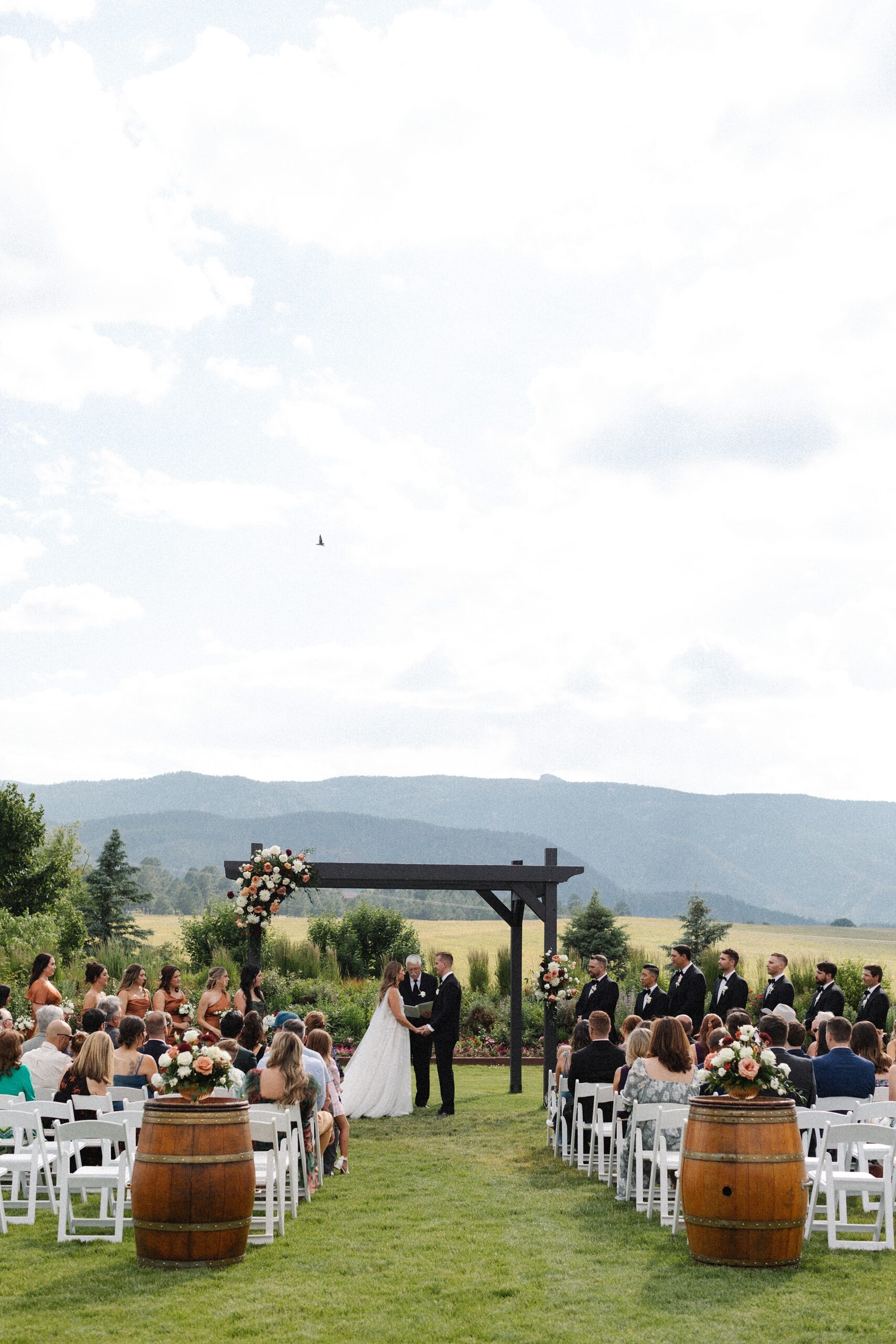 The Venue at Crooked Willow Farms Wedding, summer wedding crooked willow farms, candid wedding photography, barn wedding venues Colorado, modern barn weddings, tour of crooked willow farms, crooked willow farms wedding pricing, wedding cape inspiration, rust color bridesmaid dresses, orange and terracotta wedding colors, unique tablescapes wedding, starwars tablescape wedding idea, couples photos crooked willows, Leah Goetzel photography, Colorado wedding photographer, Denver wedding photographer