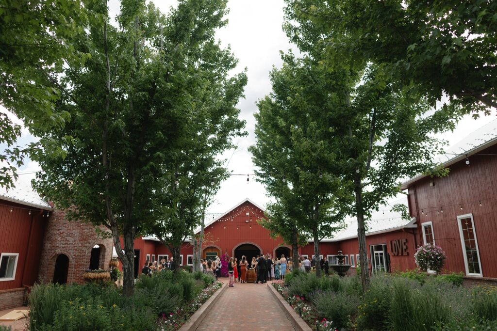 The Venue at Crooked Willow Farms Wedding, summer wedding crooked willow farms, candid wedding photography, barn wedding venues Colorado, modern barn weddings, tour of crooked willow farms, crooked willow farms wedding pricing, wedding cape inspiration, rust color bridesmaid dresses, orange and terracotta wedding colors, unique tablescapes wedding, starwars tablescape wedding idea, couples photos crooked willows, Leah Goetzel photography, Colorado wedding photographer, Denver wedding photographer