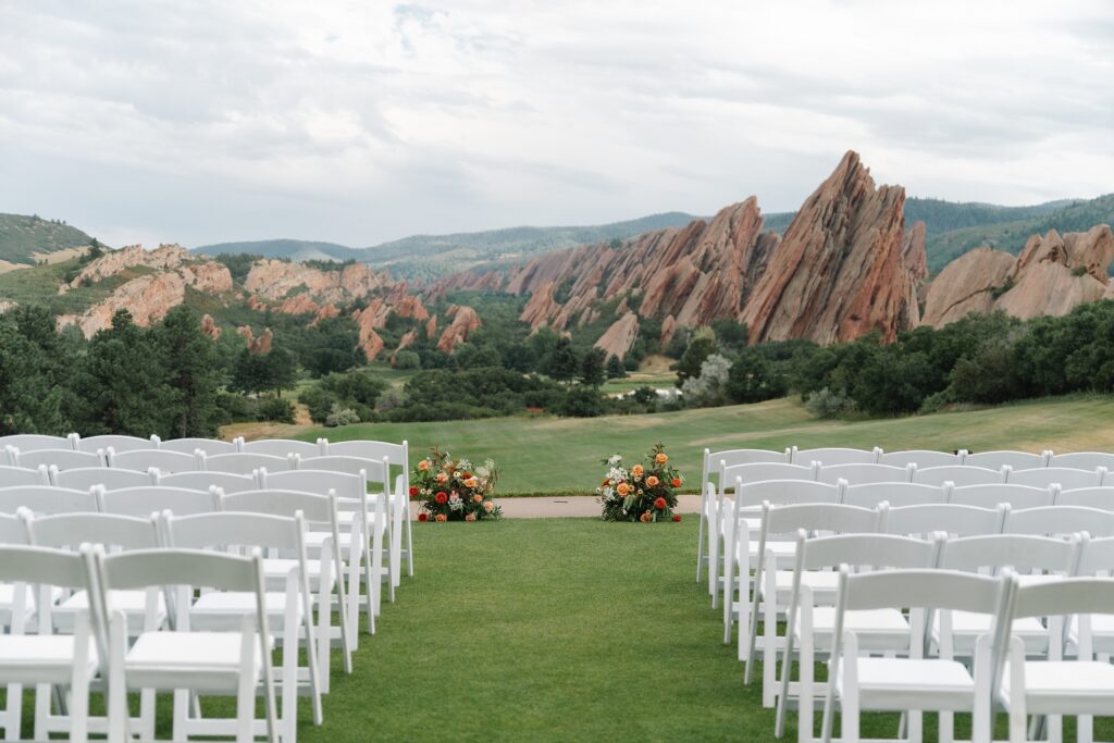 Arrowhead Golf Course Wedding, golf course wedding, Denver wedding, Colorado wedding, candid wedding photography, strapless wedding dress, old hollywood waves, shades of blue bridesmaids dresses, oranges wedding florals, Colorado wedding photographer, Denver wedding photographer, Leah Goetzel Photography