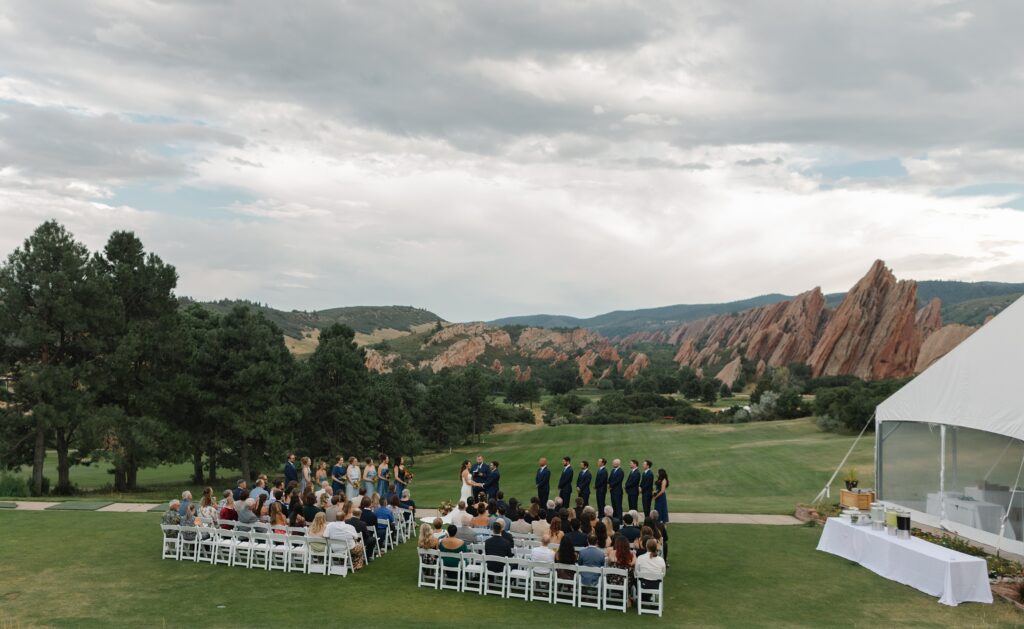 Arrowhead Golf Course Wedding, golf course wedding, Denver wedding, Colorado wedding, candid wedding photography, strapless wedding dress, old hollywood waves, shades of blue bridesmaids dresses, oranges wedding florals, Colorado wedding photographer, Denver wedding photographer, Leah Goetzel Photography