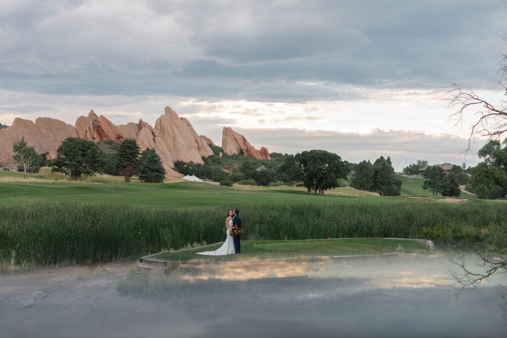 Arrowhead Golf Course Wedding, golf course wedding, Denver wedding, Colorado wedding, candid wedding photography, strapless wedding dress, old hollywood waves, shades of blue bridesmaids dresses, oranges wedding florals, Colorado wedding photographer, Denver wedding photographer, Leah Goetzel Photography