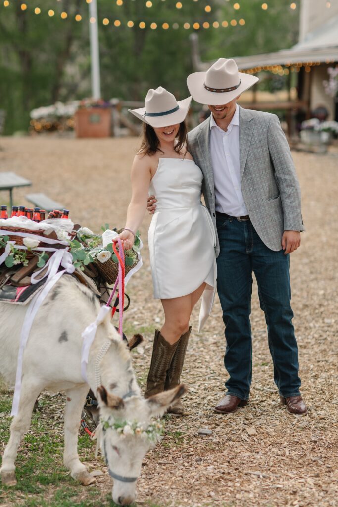 Vail rehearsal dinner, outdoor rehearsal, fun welcome party, vail wedding photographer, western themed rehearsal dinner, wedding attire with cowboy hat and boots, mechanical bull, activities for rehearsal dinner