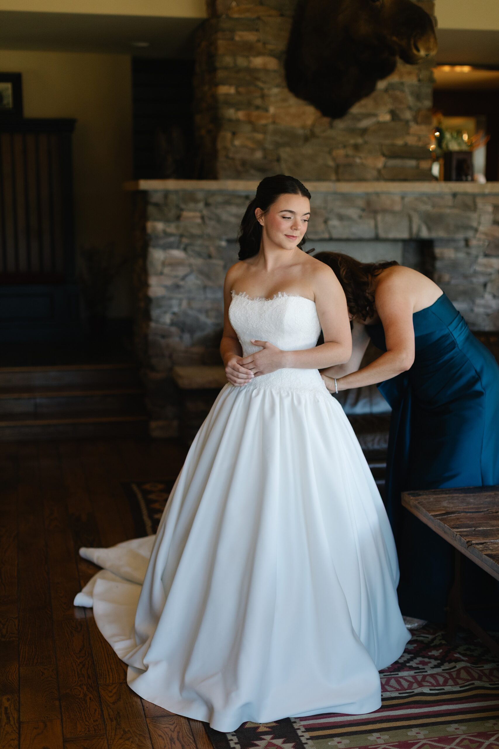 4 Eagle Ranch Wedding, Colorado wedding photographer, Vail wedding venues, getting ready venue, putting dress on, candid getting ready, strapless wedding dress